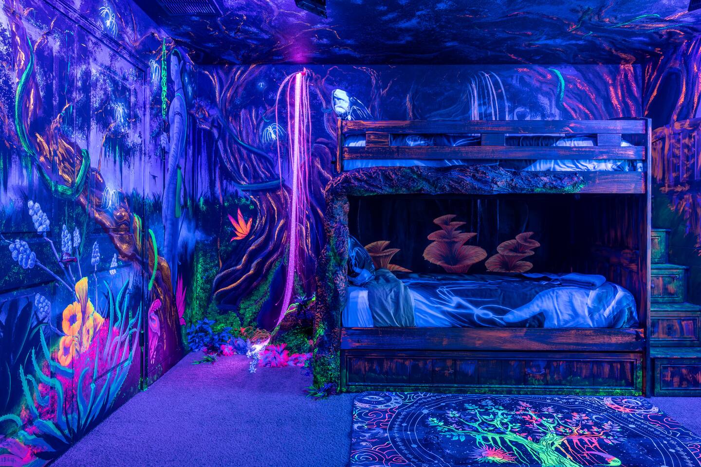 Avatar-themed room glowing under blacklight with hand-painted bioluminescent for