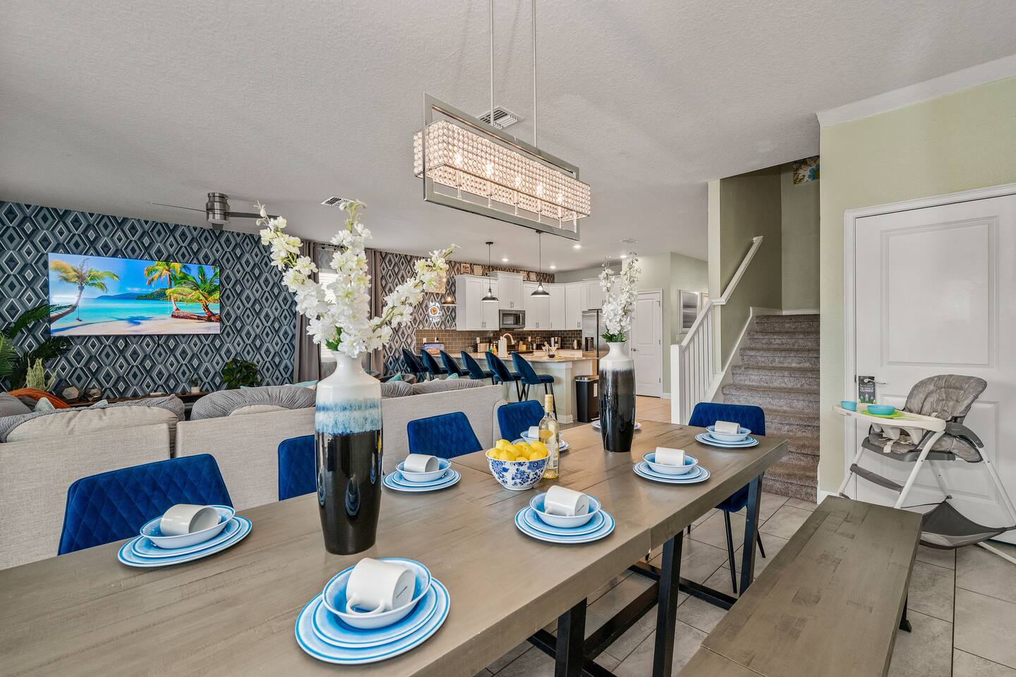 Dining table with seating for the whole group plus bench, open to the kitchen an