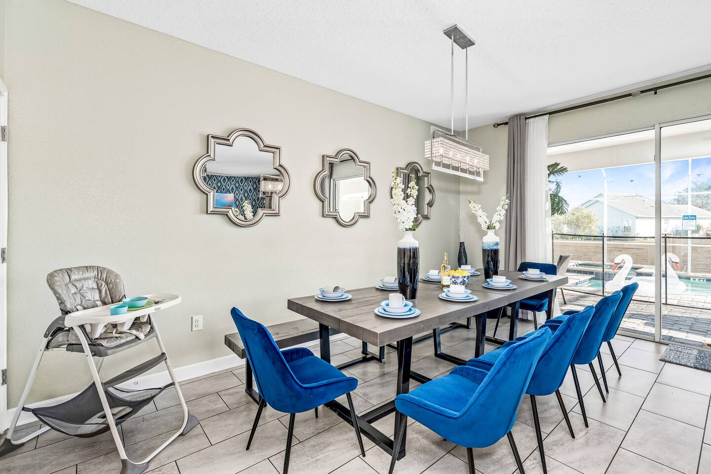 Dining area for eight with pool views through the sliding glass doors