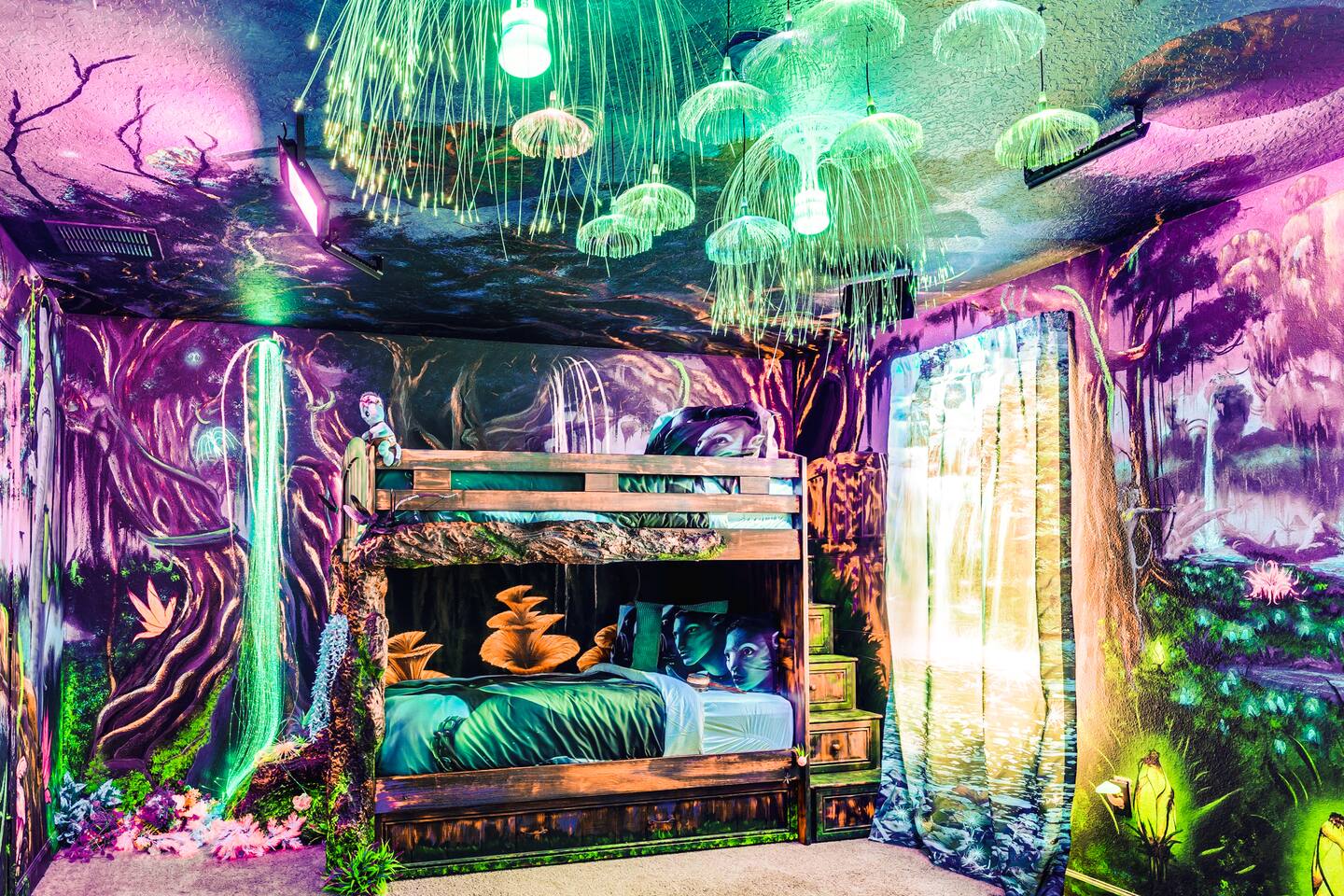 Glowing jellyfish canopy lights above the Avatar room's forest-themed bunks