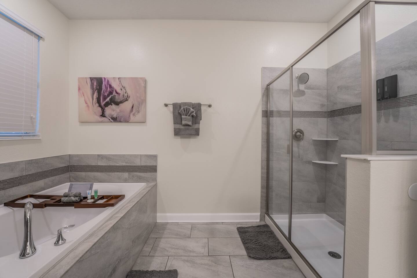 Primary bathroom with garden soaking tub and glass walk-in shower