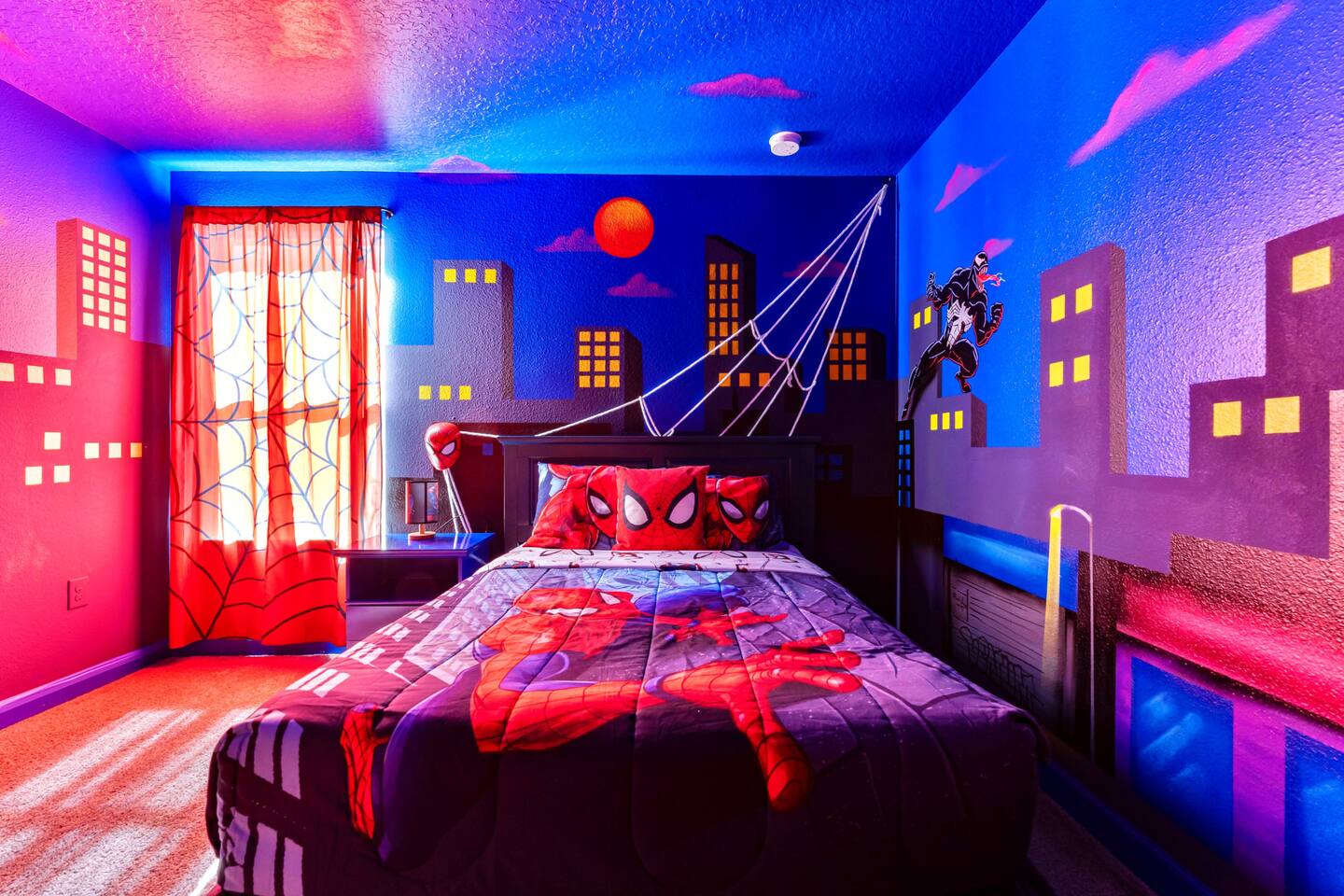 Spider-Man themed bedroom with glowing skyline mural and web-slinging headboard 