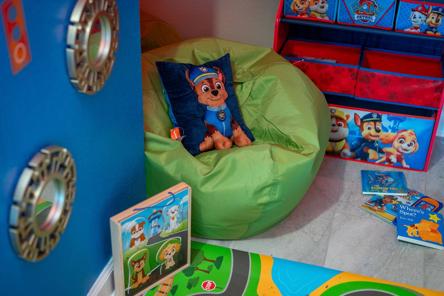 Paw Patrol reading nook with bean bag chair, books, and toy storage