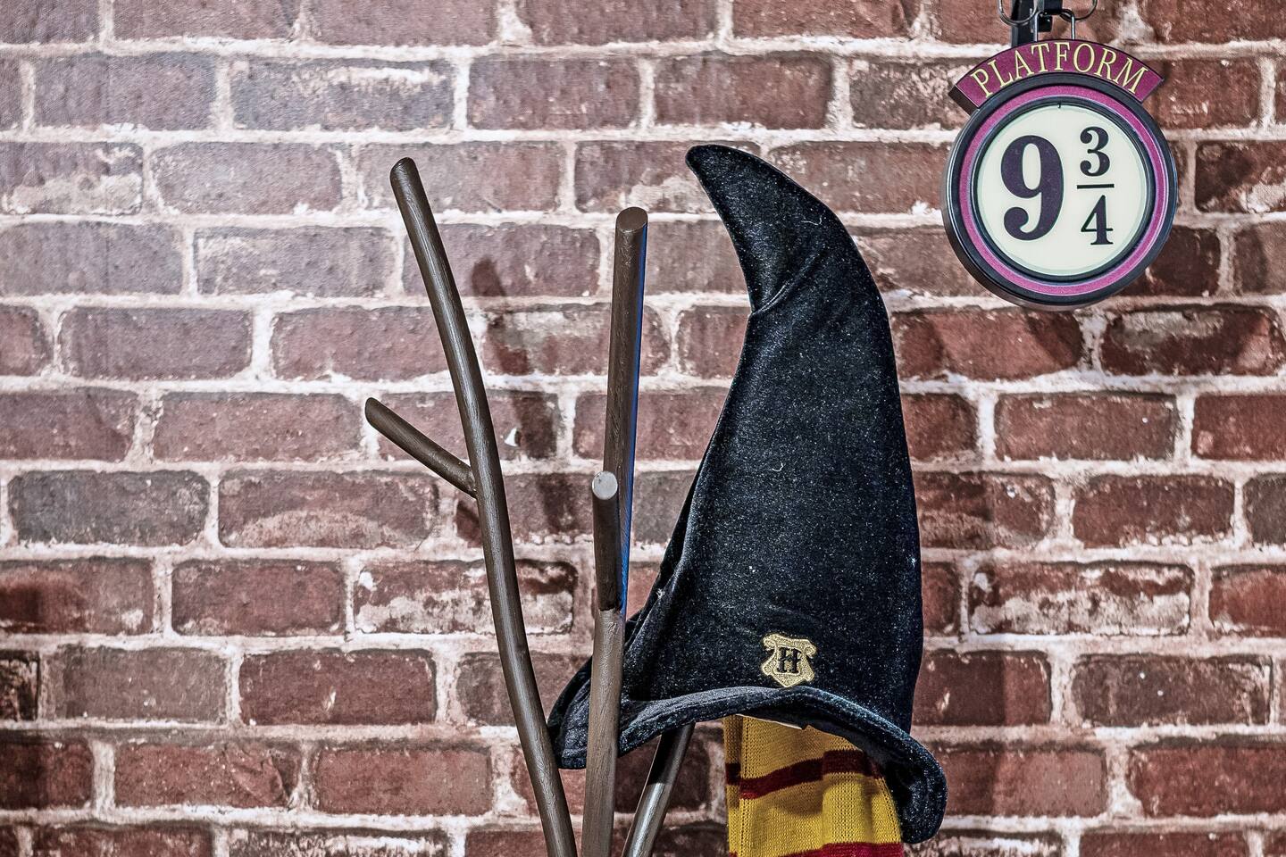 Sorting hat, wands, and Platform 9 3/4 sign in the Harry Potter room