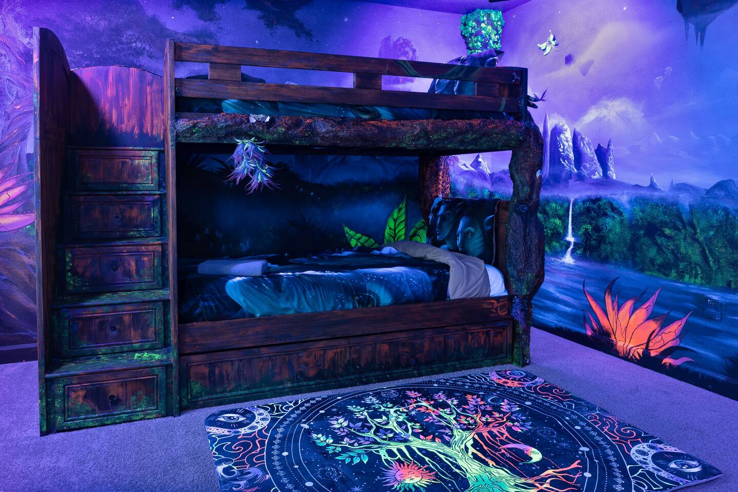 Carved-tree bunk beds with trundle in the glow-in-the-dark Avatar room