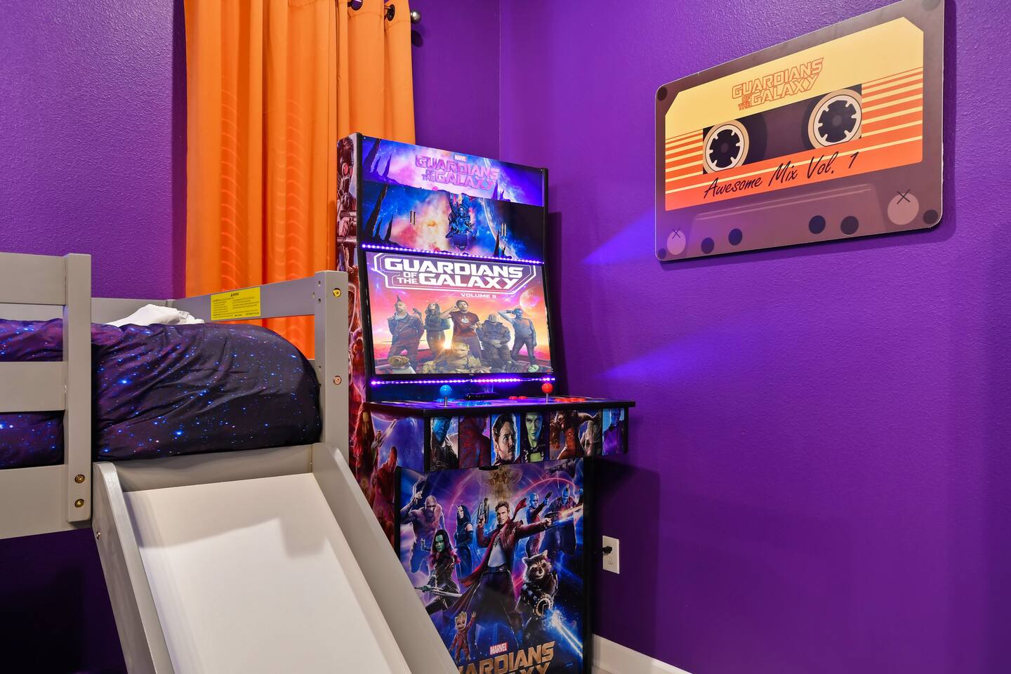 Guardians of the Galaxy arcade cabinet beside the bunk slide