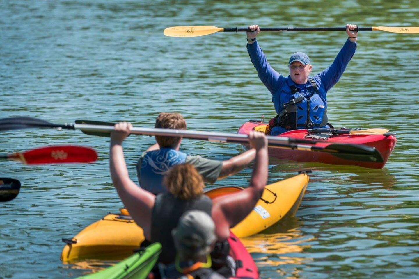Guests kayaking on the resort lake