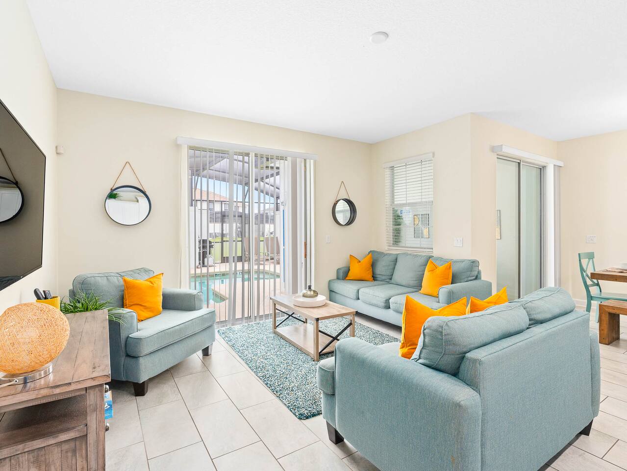 Bright and airy space with vibrant accents, perfect for relaxing by the pool!