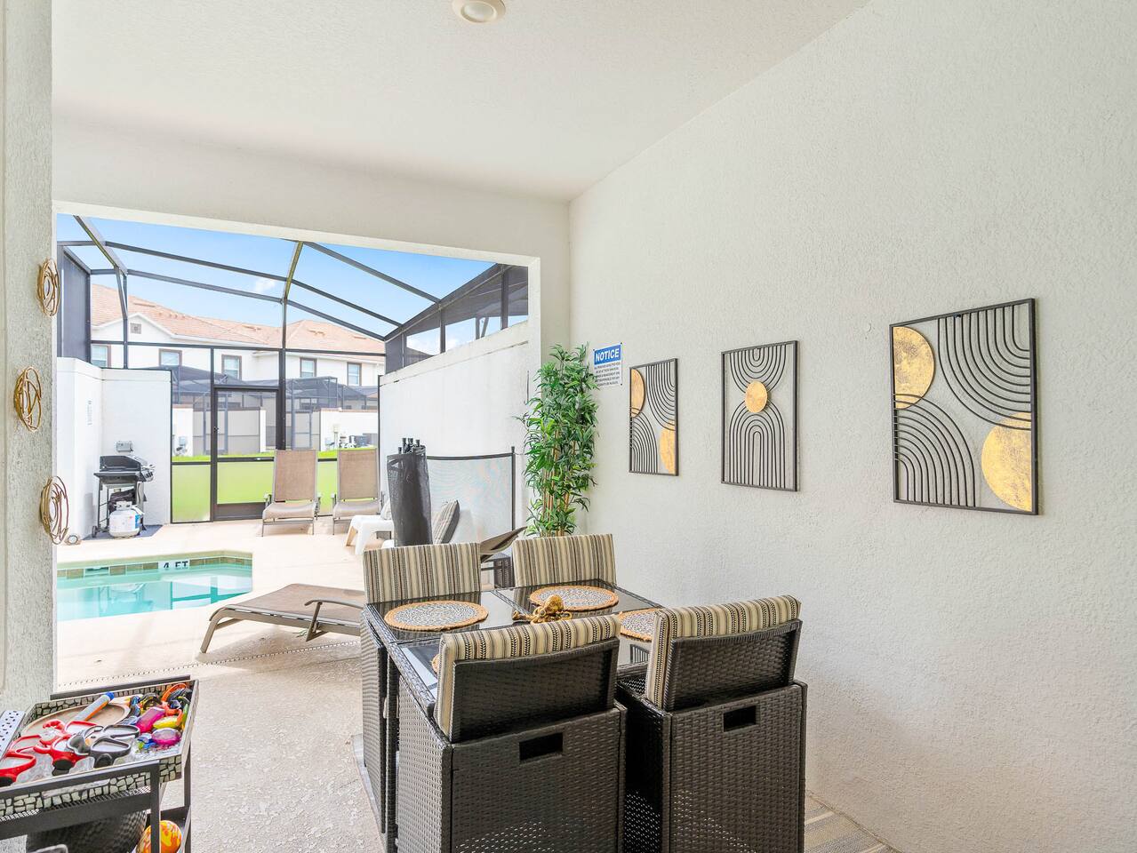 Enjoy alfresco dining with pool views in this stylish outdoor retreat!