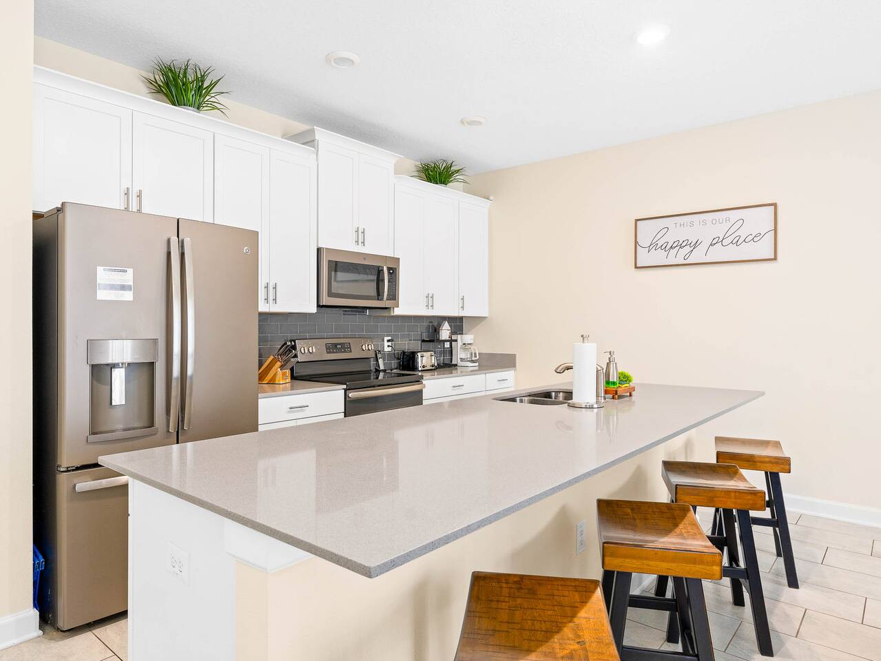 Kitchen: Bright and modern space with sleek appliances and a stylish island for 
