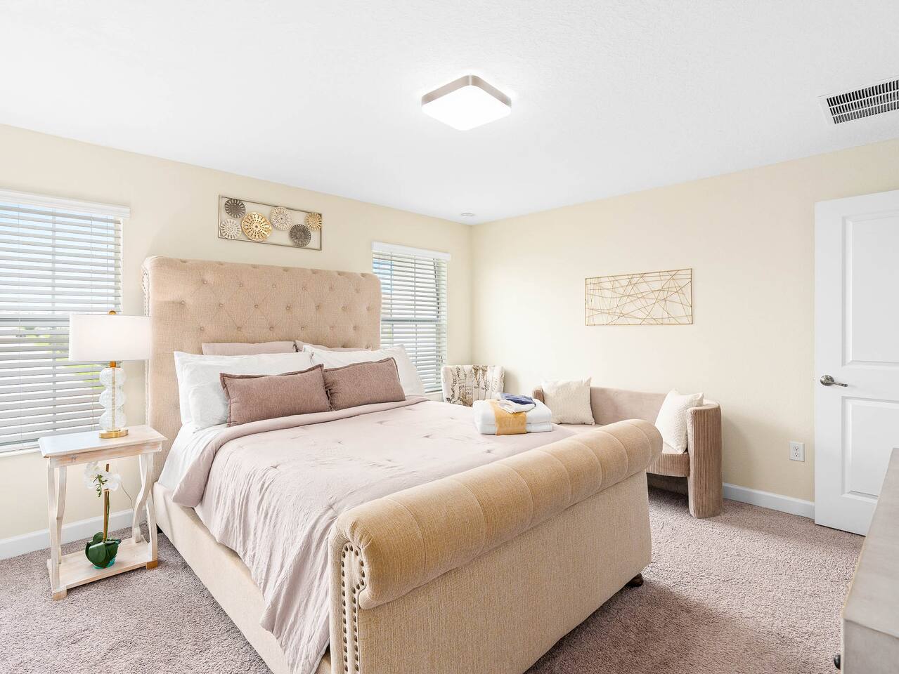 Stylish retreat with plush bedding, ample light, and serene views awaits you!