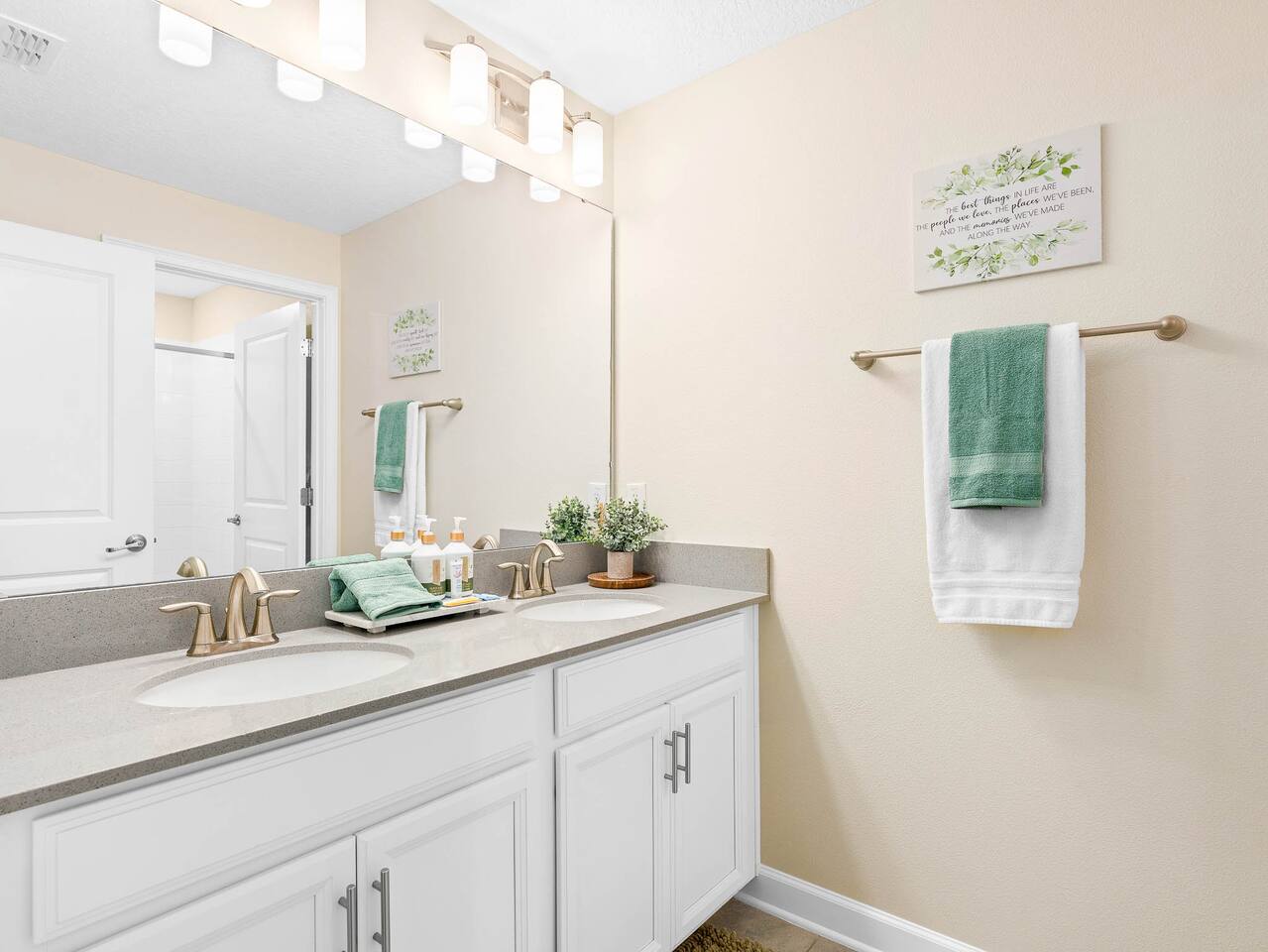 Luxurious Ensuite: Bright and airy space featuring dual sinks and stylish decor 