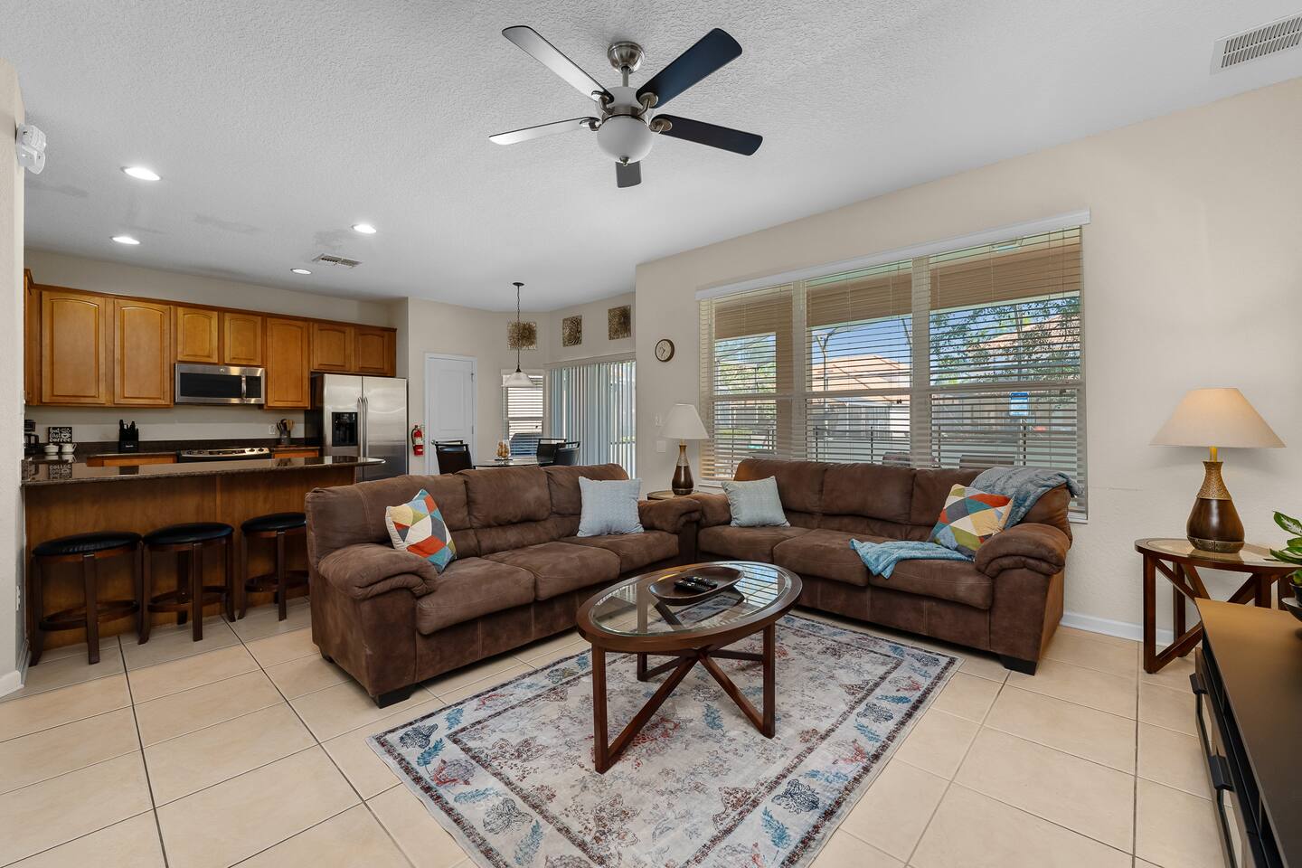 Inviting space with comfortable seating and a view of the lush outdoors!