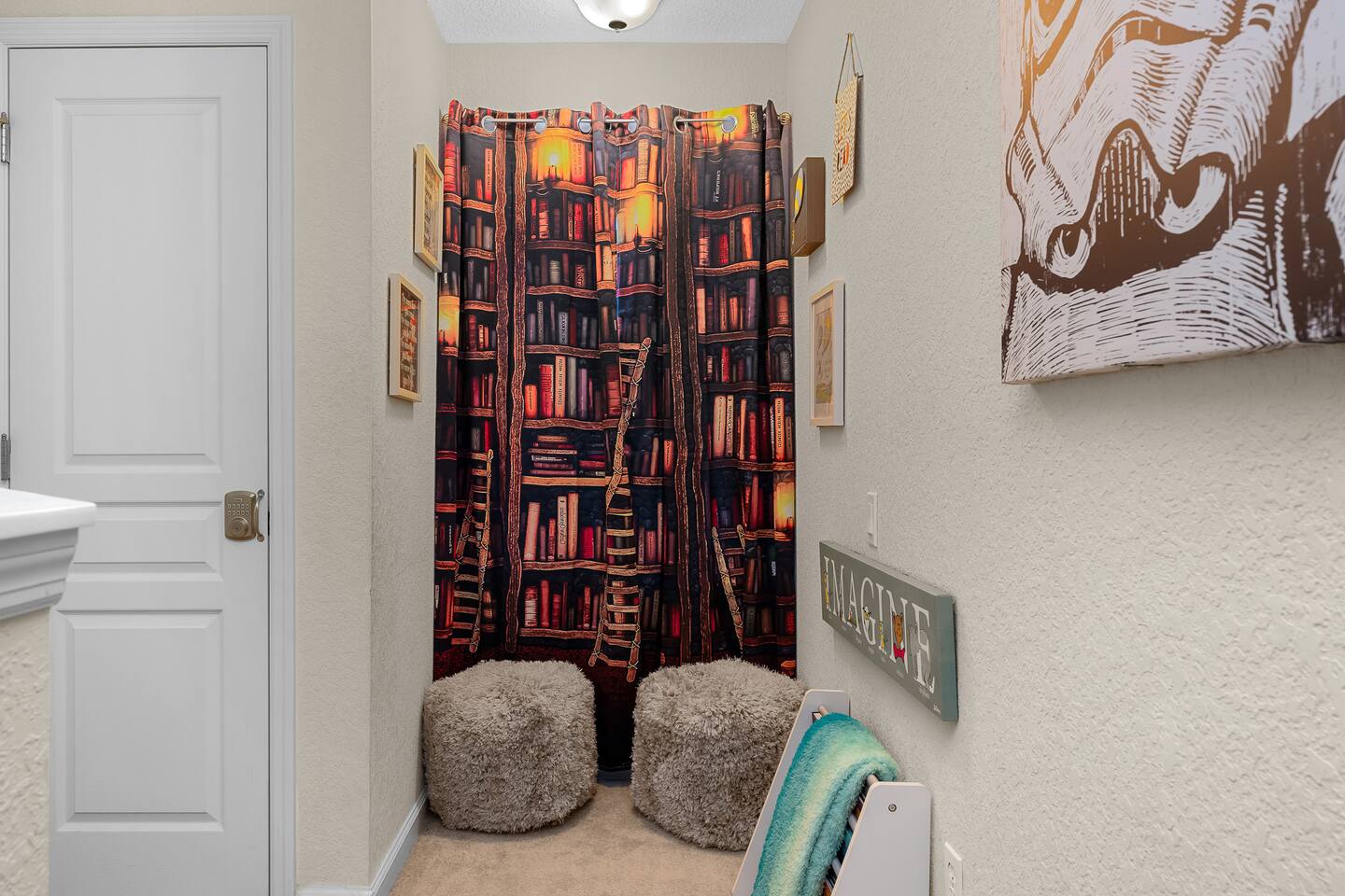 Whimsical nook with fluffy seating and a charming bookish backdrop!