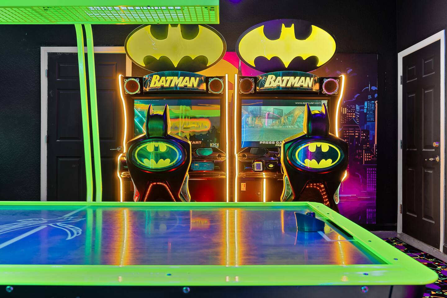 Game Room: Unleash fun with Batman arcade games and vibrant neon decor! Perfect 