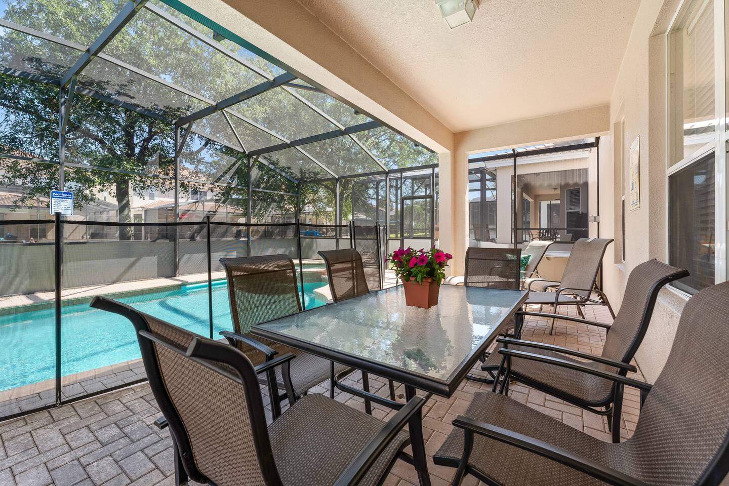 Outdoor Lounge: Relax by the sparkling pool with stylish seating and vibrant blo