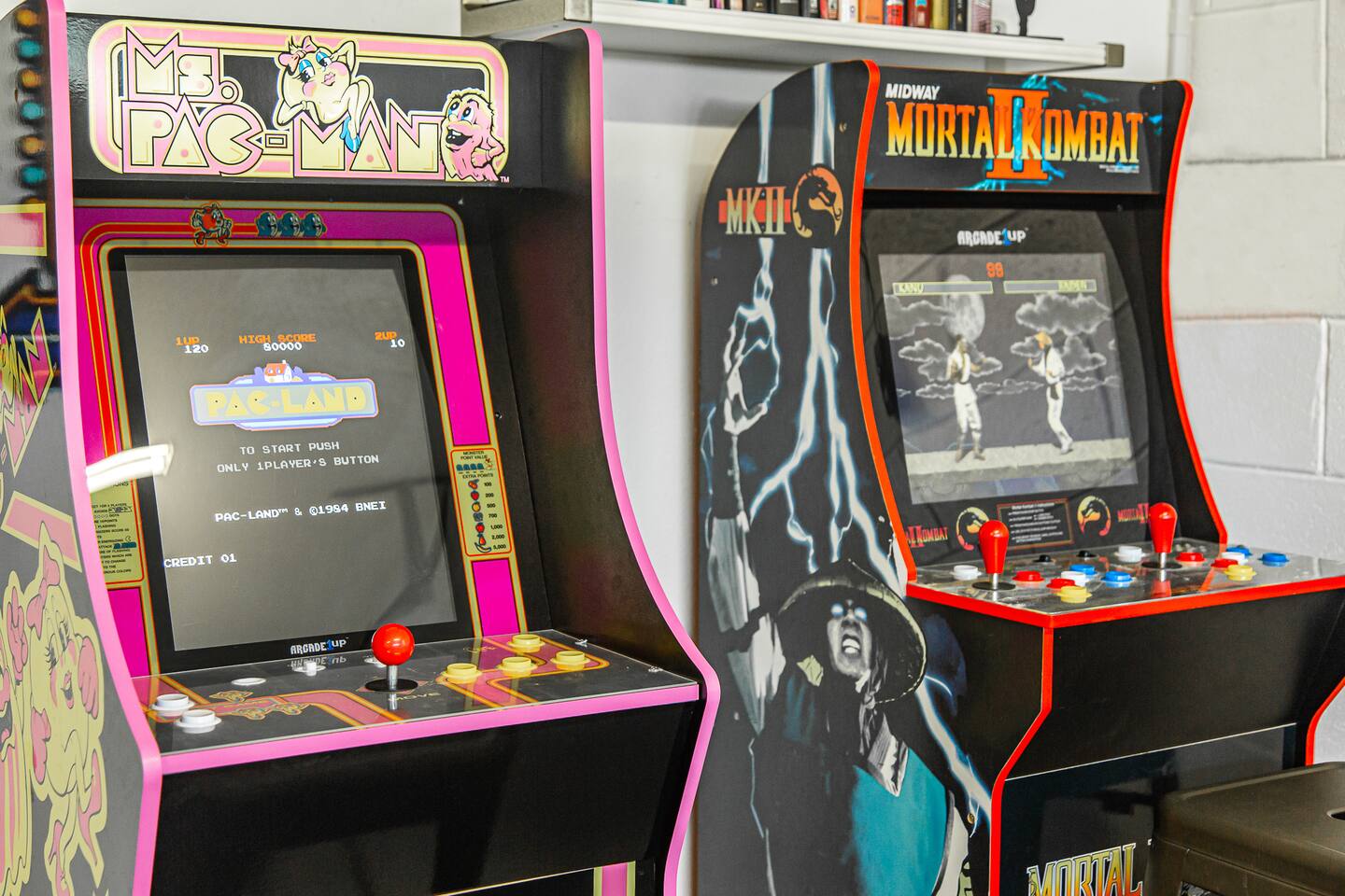 Close-up of the Ms. Pac-Man and Mortal Kombat II arcade cabinets.