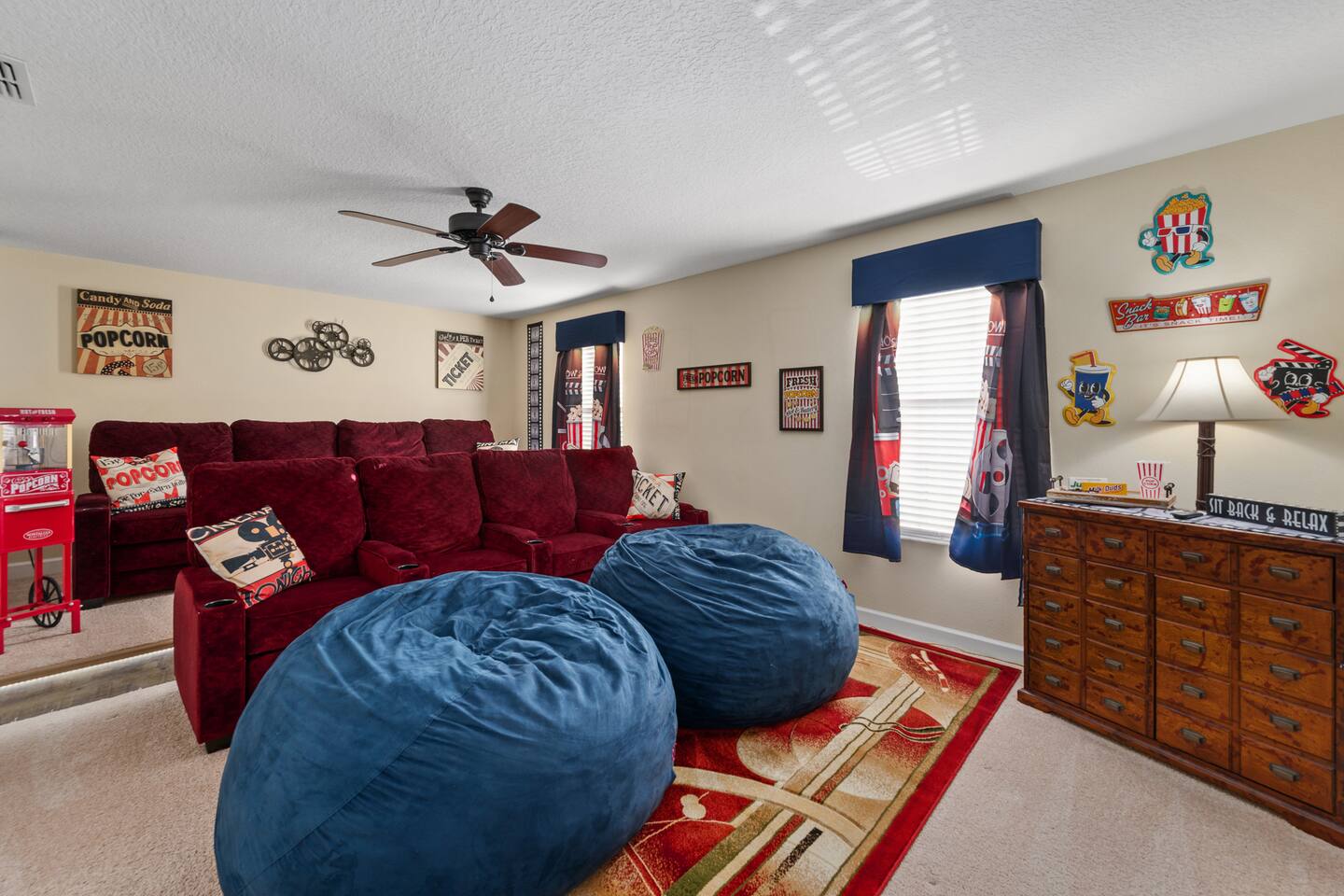 Theater seating for the whole crew — recliners up front, giant bean bags for the