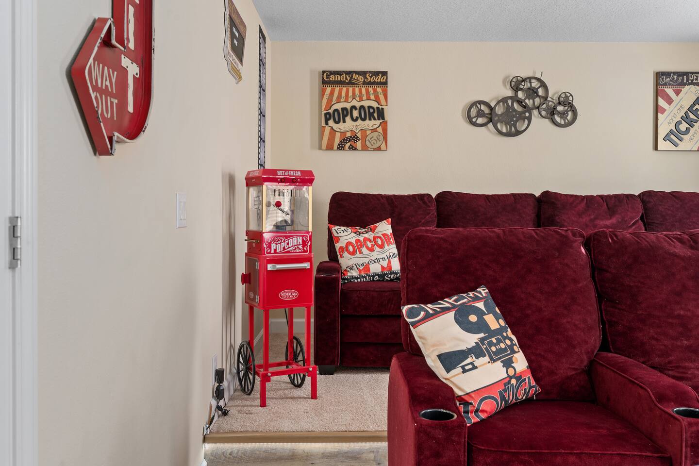 Vintage-style popcorn cart and cinema decor set the mood for movie night.