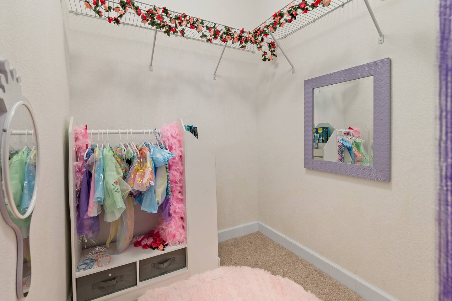 Dress-up closet stocked with costumes, tiaras and a mirror for royal fittings.