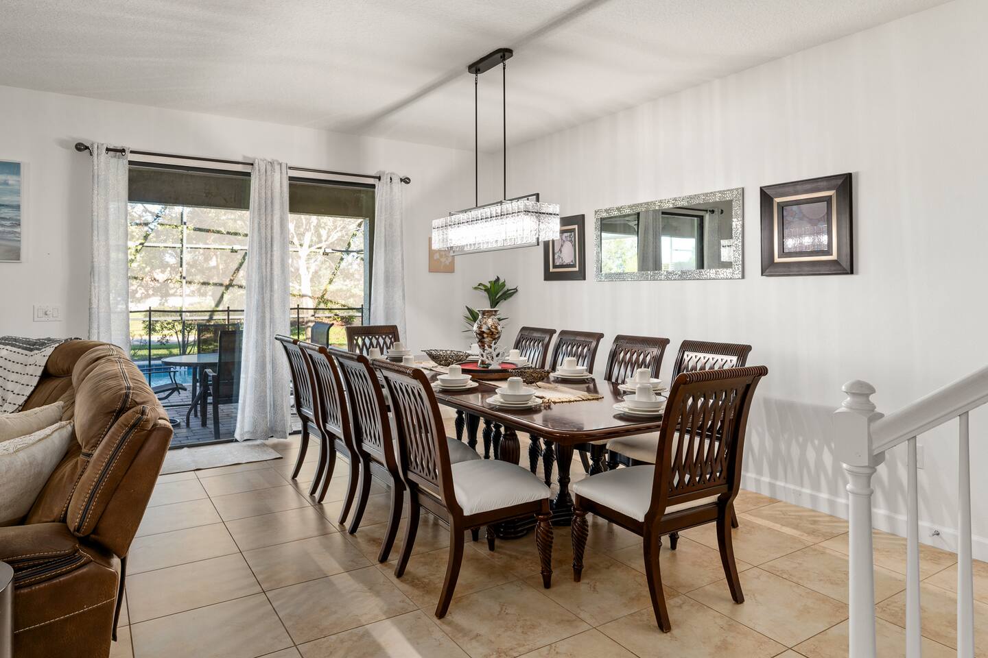 Formal dining room with a long table set for the whole group.
