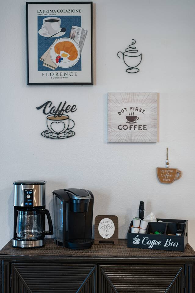 The coffee bar: drip brewer, pod machine and a fully stocked caddy for slow morn