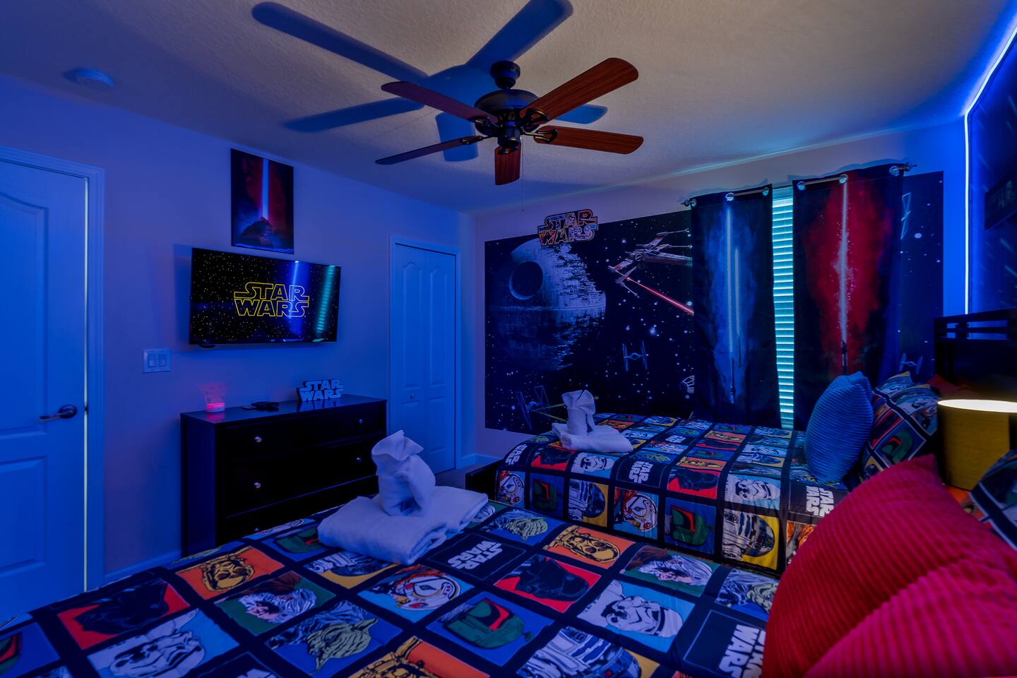 The Star Wars room's own TV, dresser and blackout galaxy curtains.