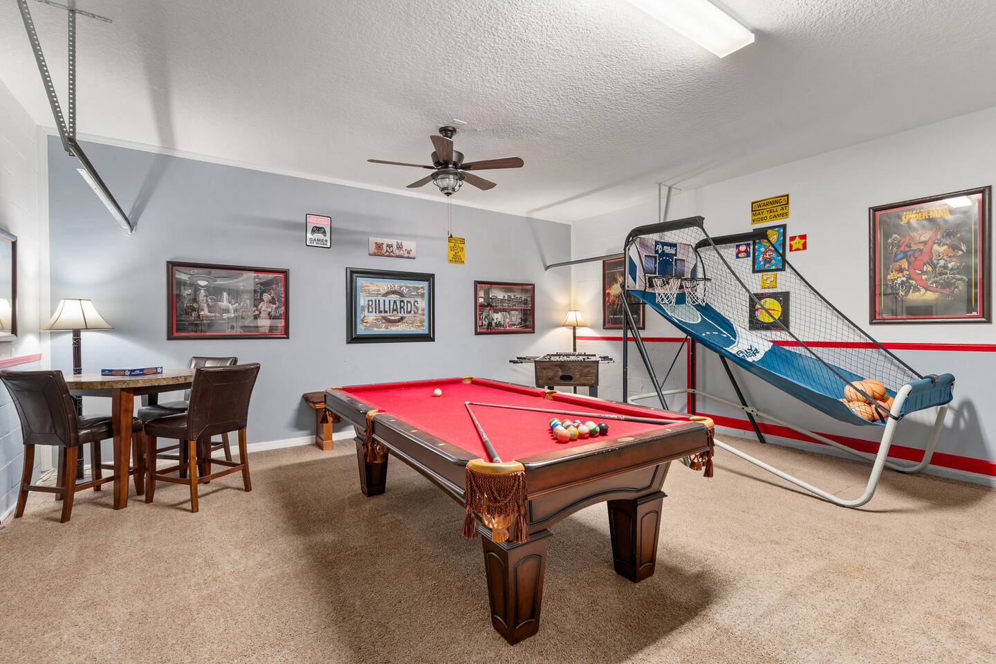 The garage game room — billiards, pop-shot basketball, foosball and a game table
