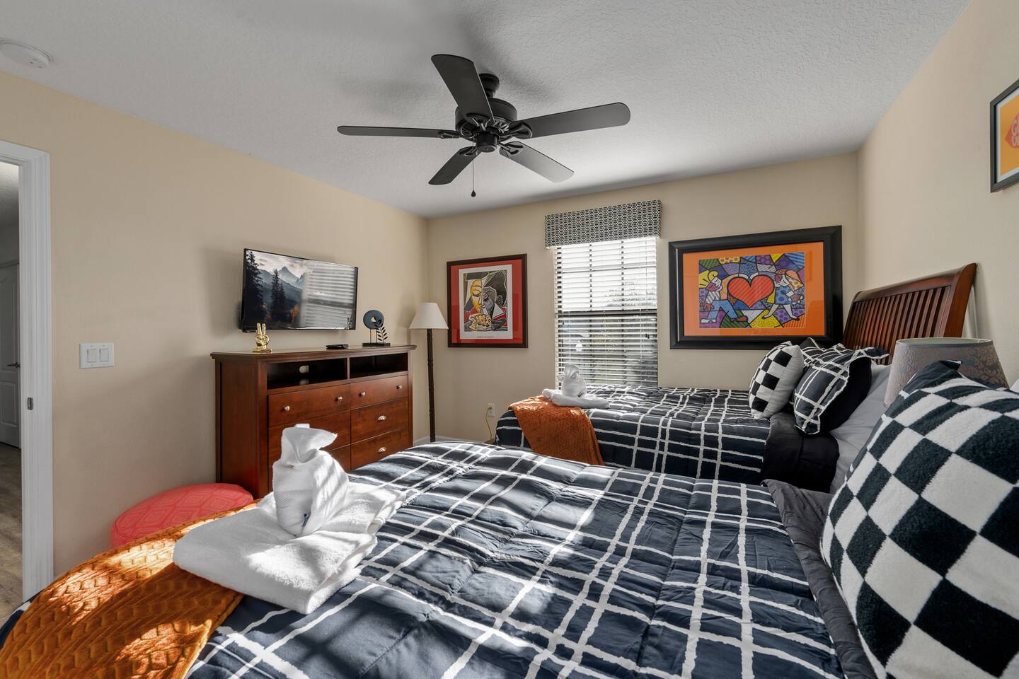 Pop-art color and crisp black-and-white bedding in the modern double room.