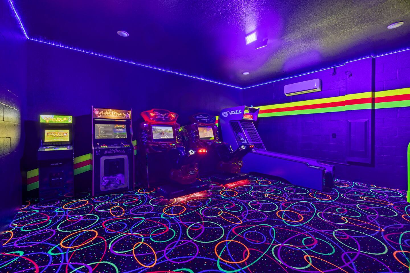 Arcade room lineup: golf arcade cabinet, multicade, two motorcycle racing simula