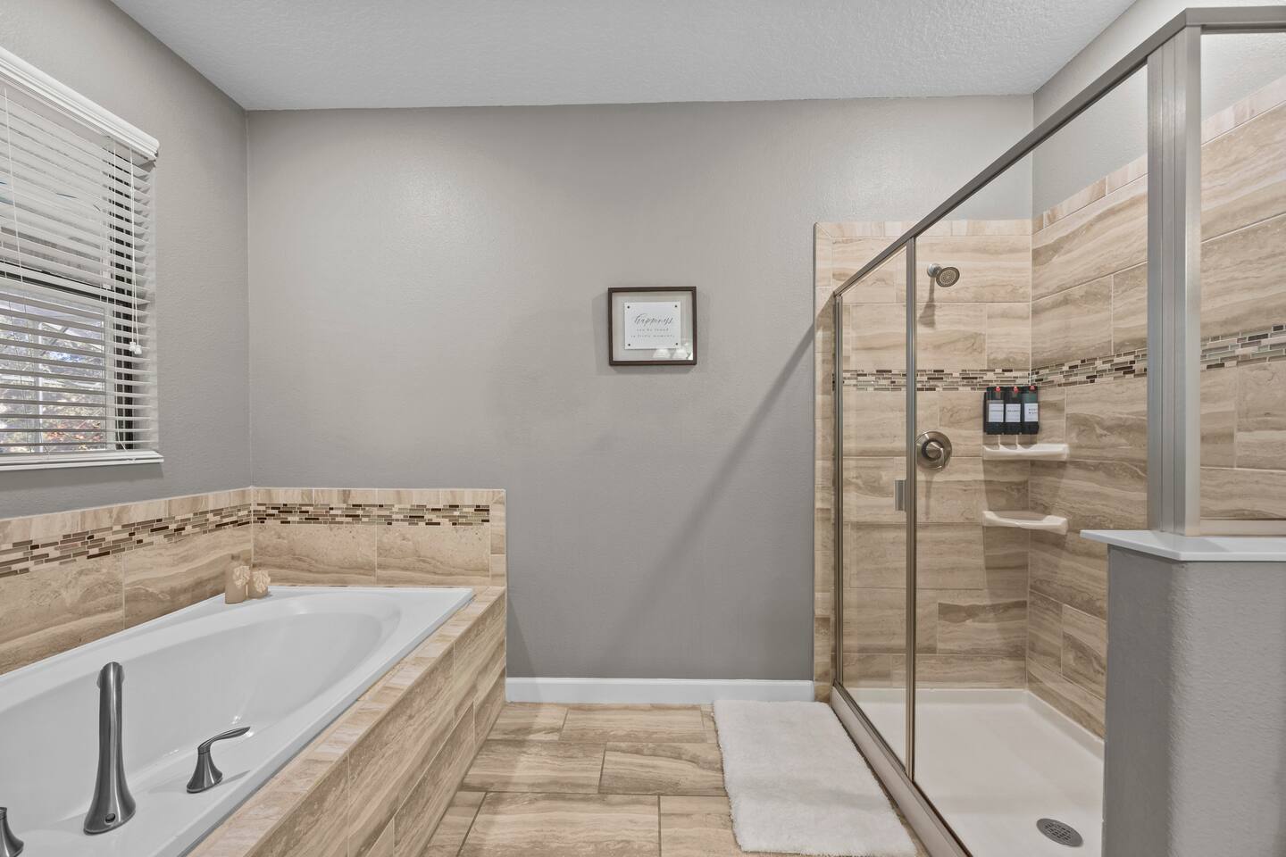 Primary bathroom with garden soaking tub and separate glass walk-in shower