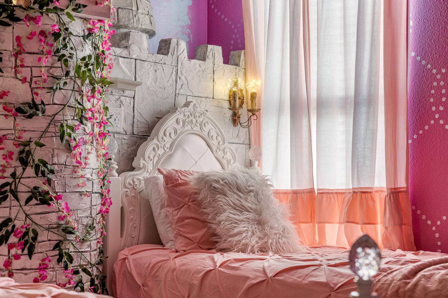 Princess bed detail with castle headboard wall and flower vines