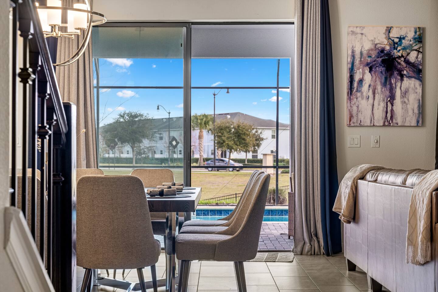 Dining area with sliding doors opening to the private pool