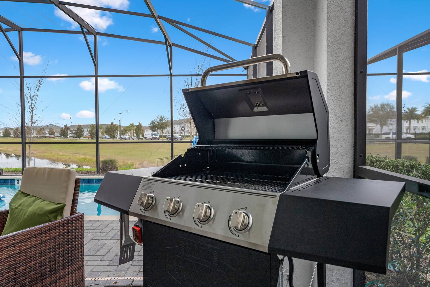 Gas grill on the screened pool deck
