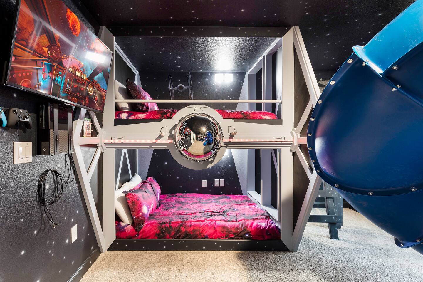 Galactic Bunk Room: Blast off in style with themed beds and a fun slide for endl