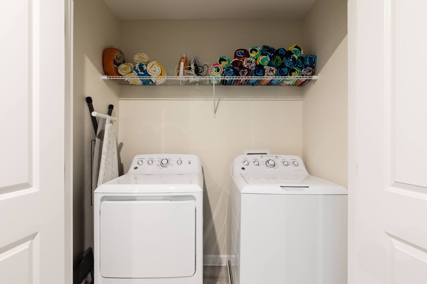 Washer/dryer and pool towels convenient to the bedrooms.