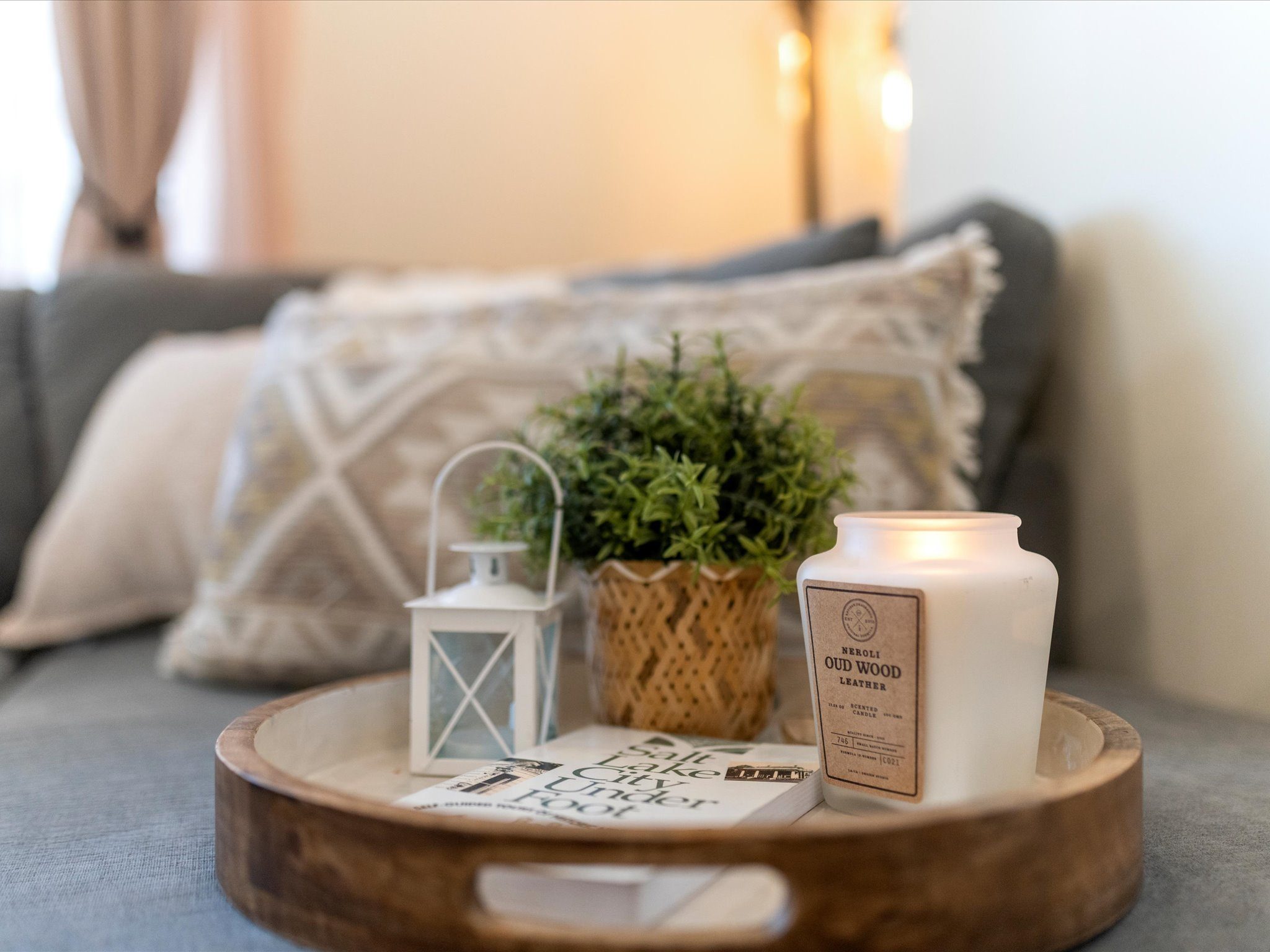 Cozy living room with plush pillows, and serene touches for relaxing evenings.