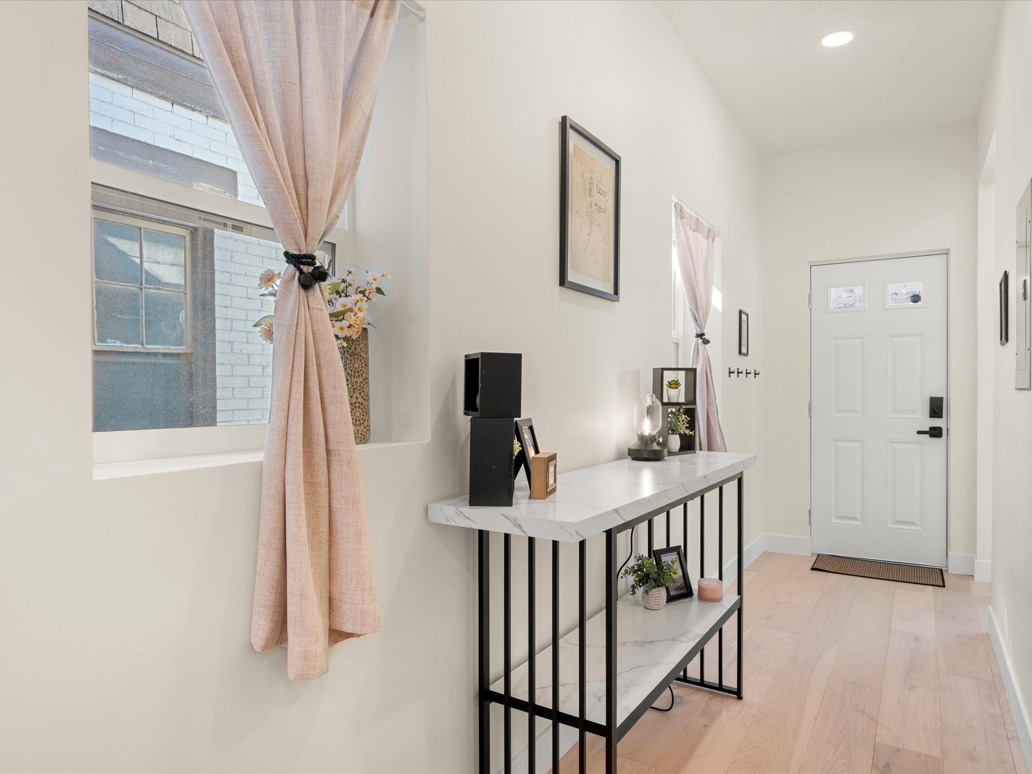 Entry foyer with a console table and natural light