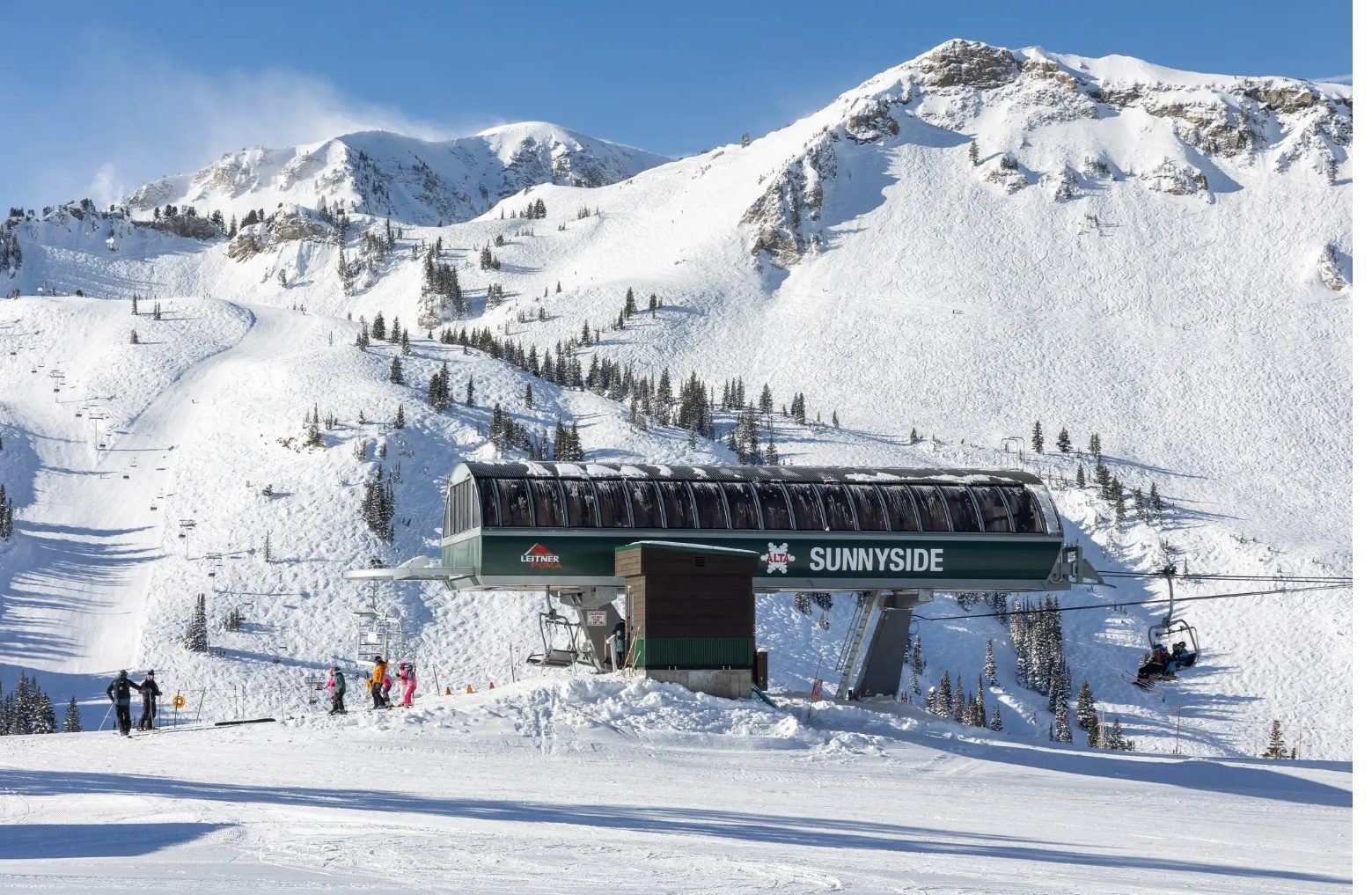 Alta Ski Area's Sunnyside lift beneath snow-covered peaks