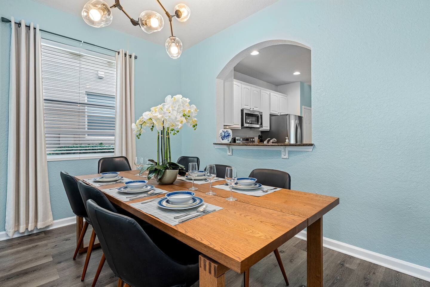 Dining room seats six, with a pass-through to the kitchen.