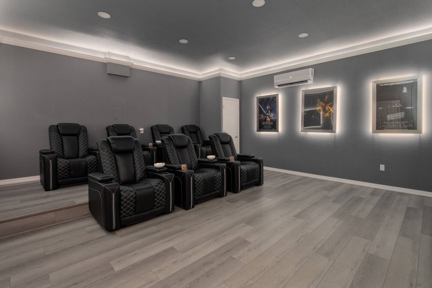 Tiered stadium seating for eight in the private theater.