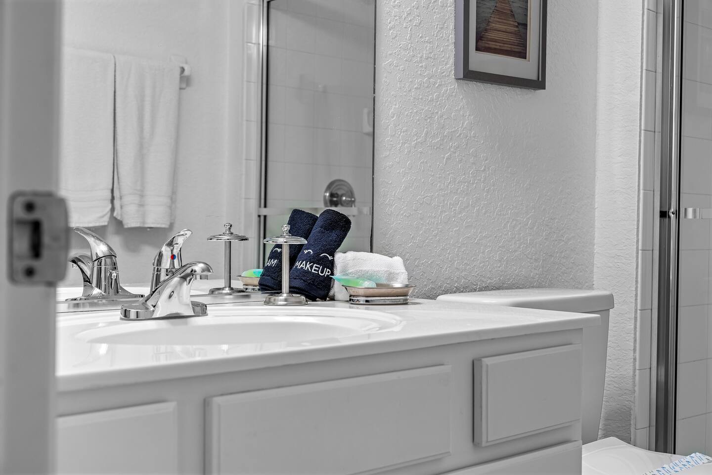 Fresh towels and makeup cloths set out at the vanity.