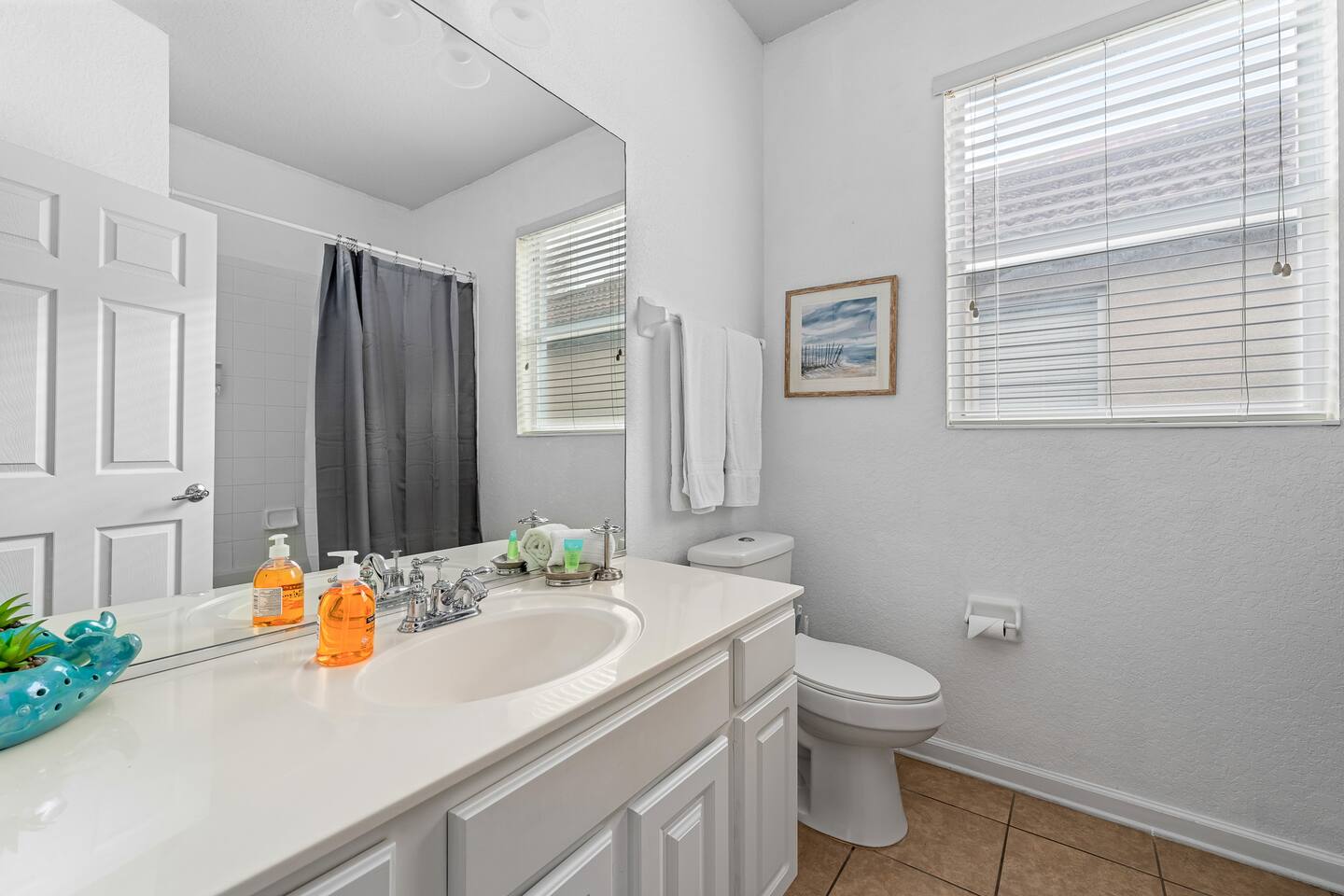 Full bathroom with a combination tub and shower.