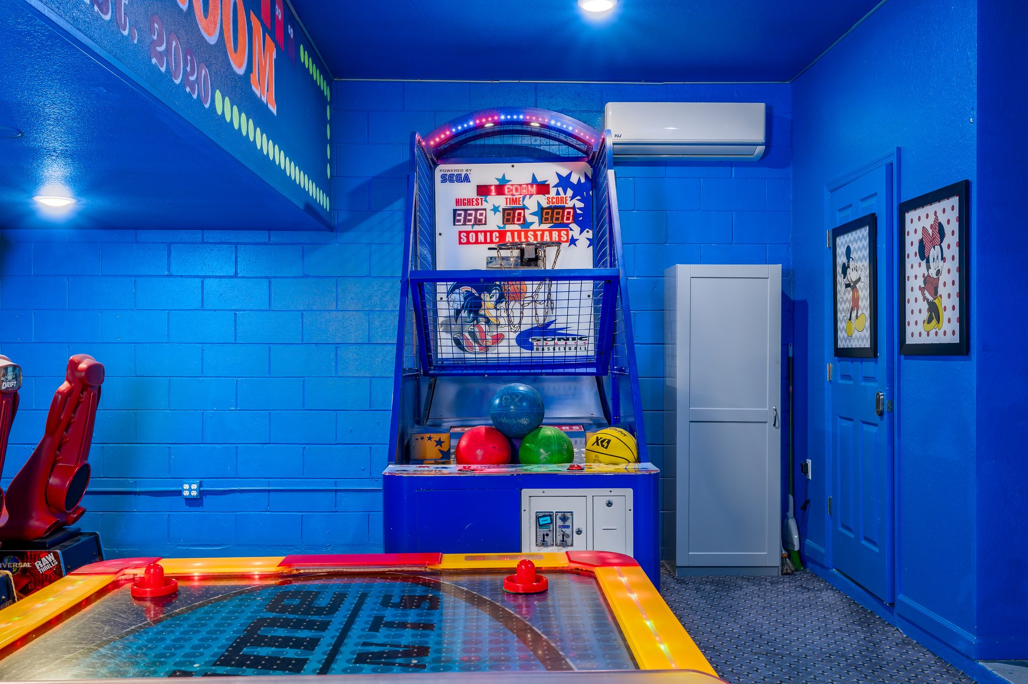 Vibrant arcade room: air hockey, hoops & racing—A/C cooled fun