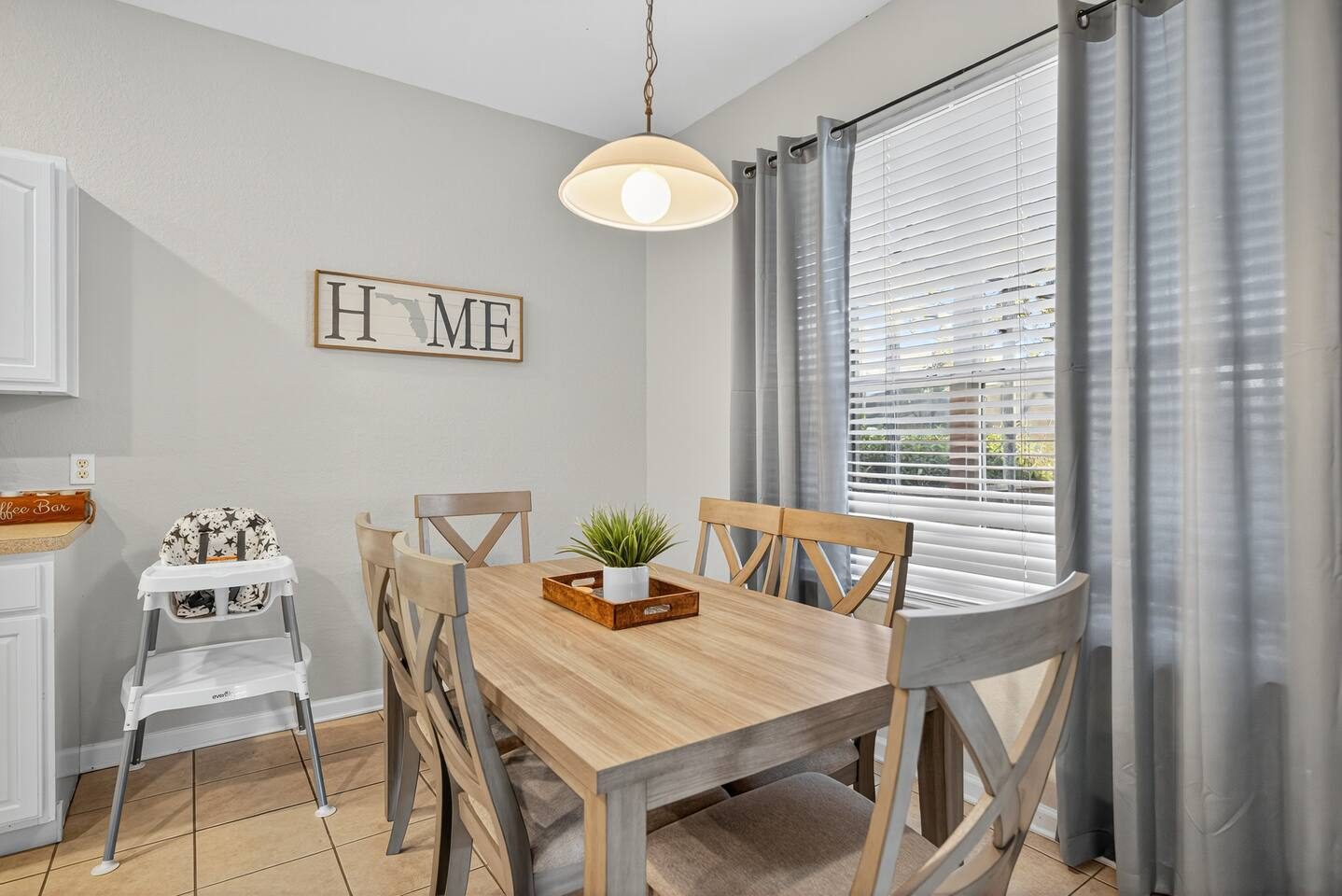 Family Dining | Elegant wood accents and a high chair for little ones.