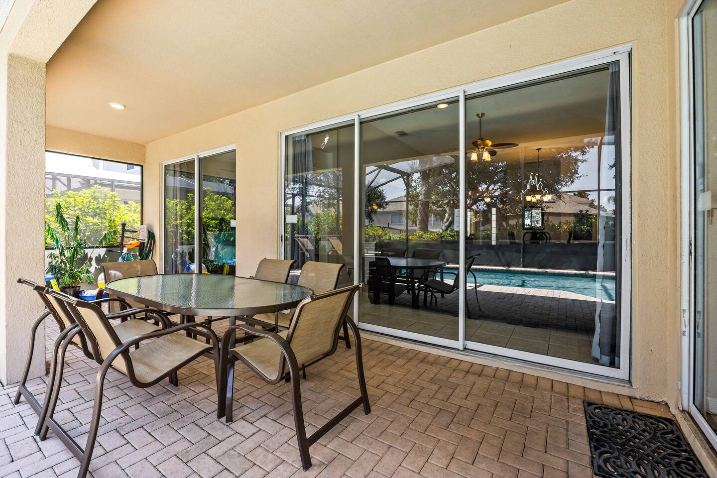 Poolside Dining | Savor every meal in this charming screened patio.