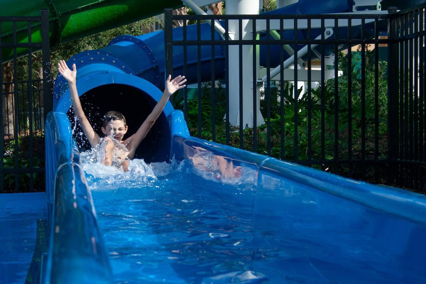 Water Slide Adventure: Splash into fun with thrilling slides right in your backy