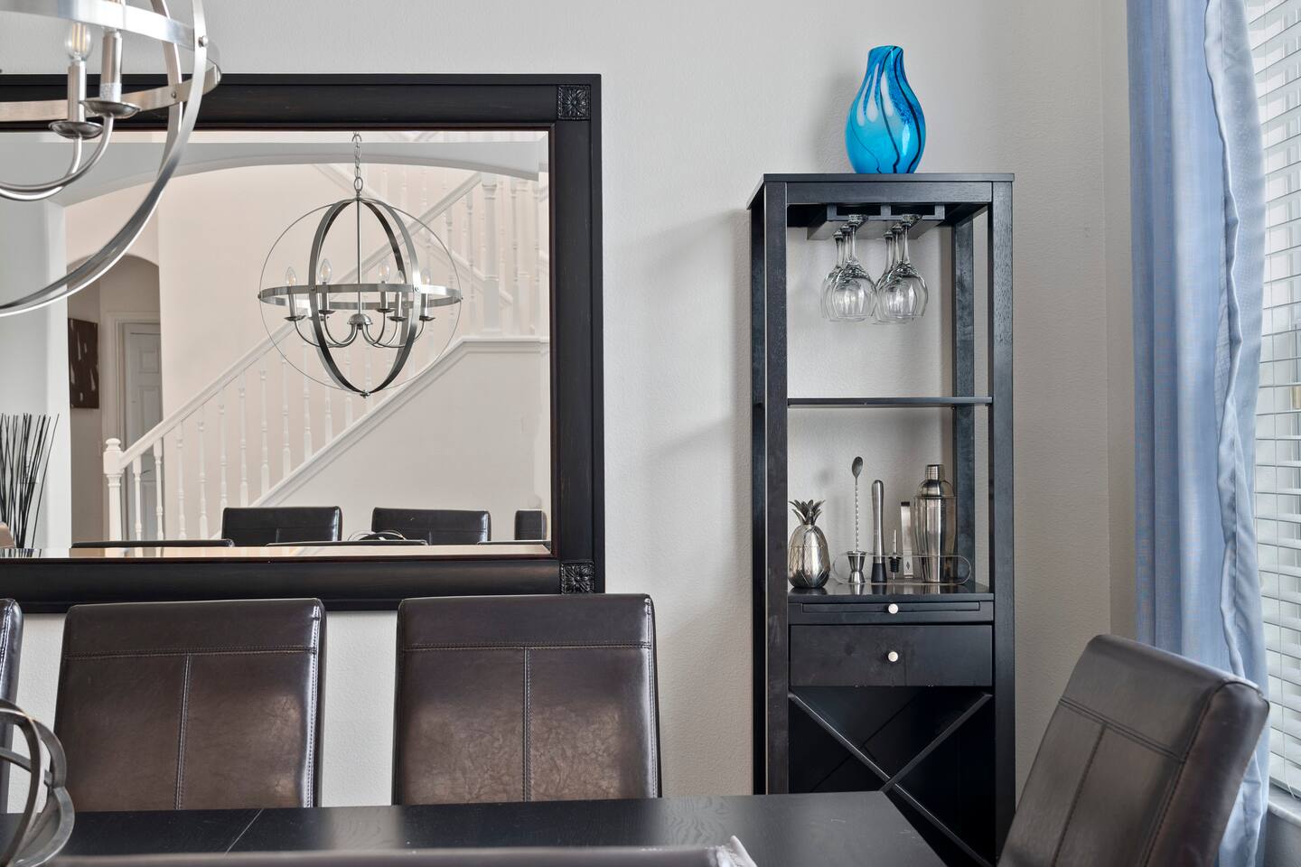 Elegant space perfect for gatherings, featuring chic decor and a stylish chandel