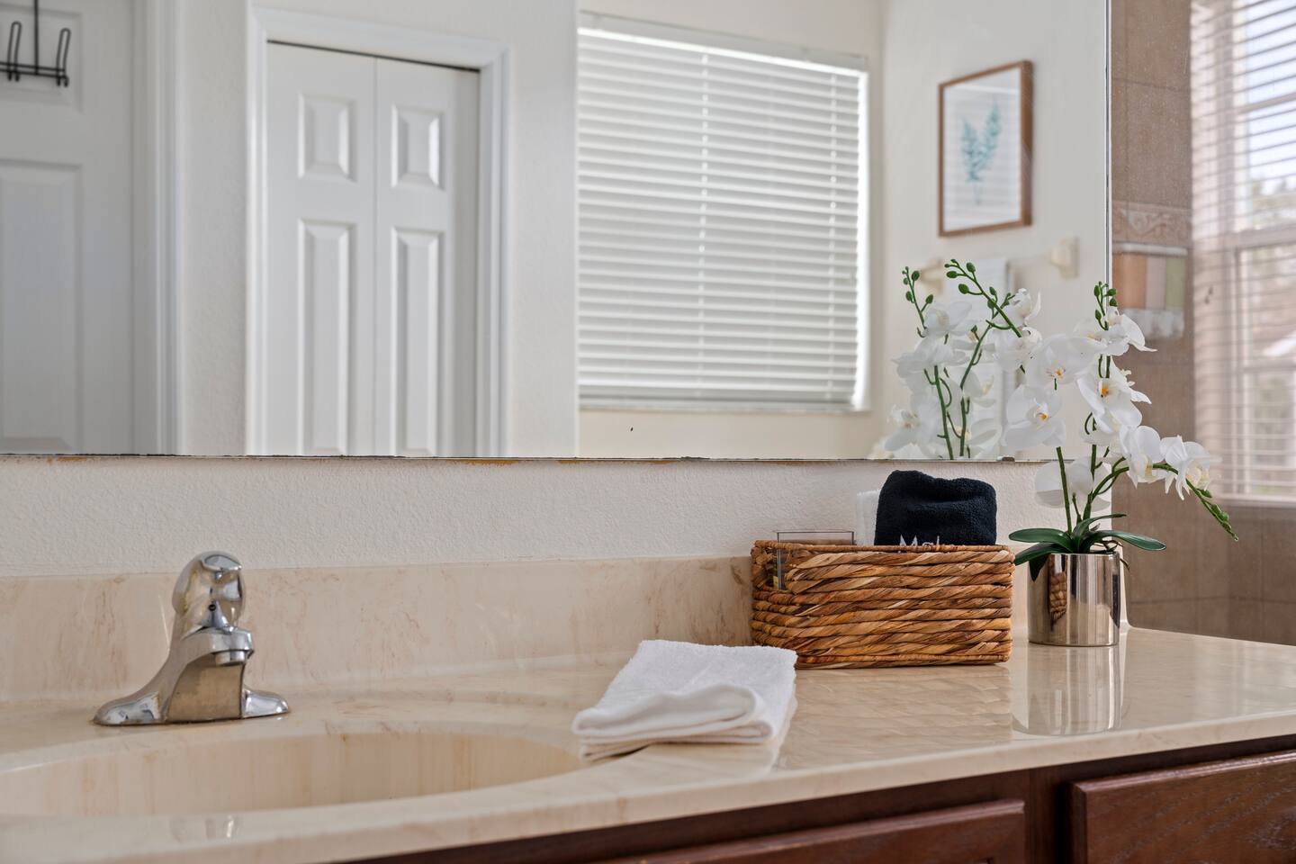 Elegant vanity with modern fixtures and serene decor for your relaxation.