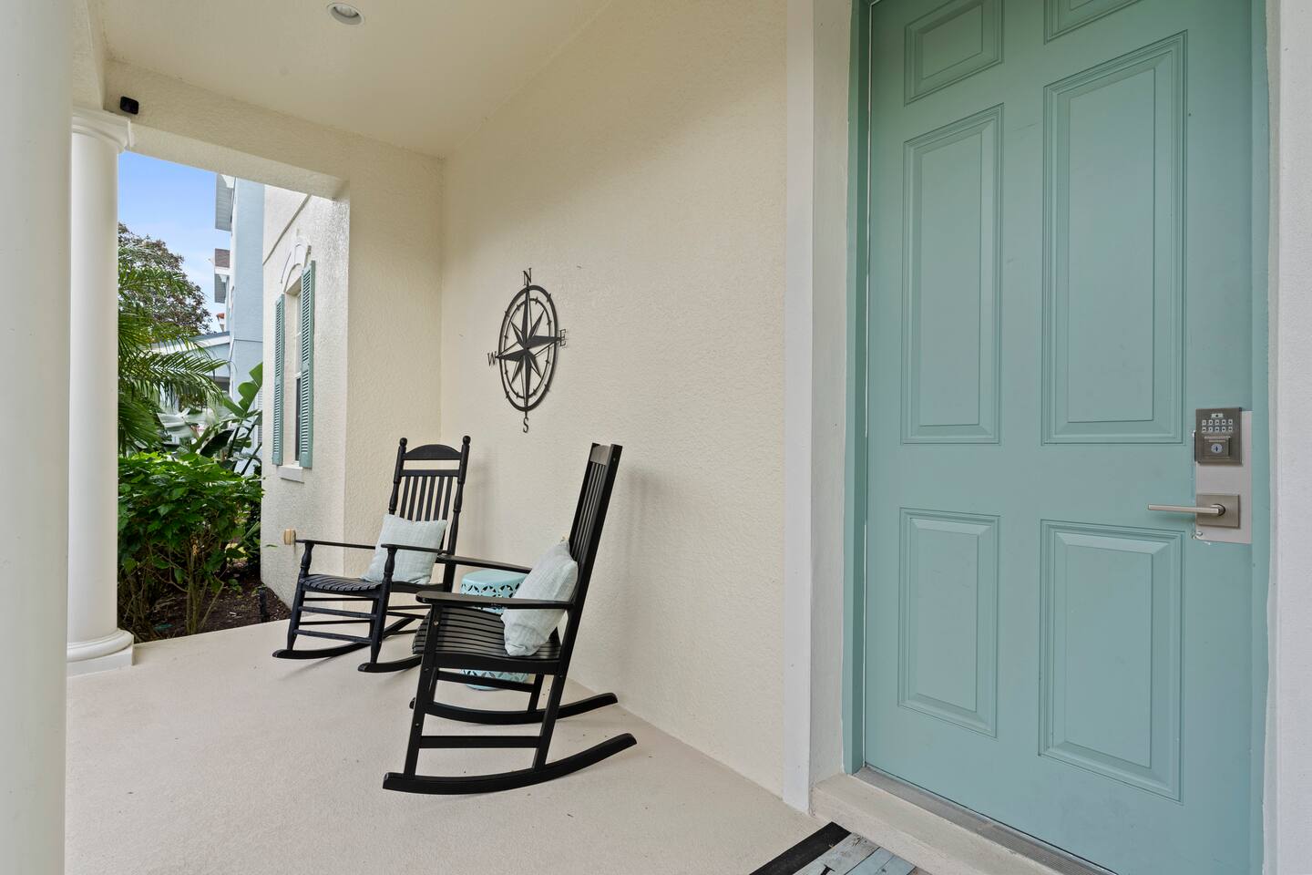 Sip coffee on the porch while enjoying the lush greenery and gentle Florida bree